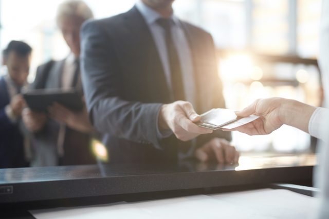 Man at airport ticket counter