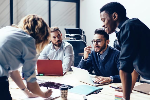 A team of office professionals having a meeting.