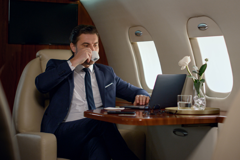 Buinsess man sitting in a private jet